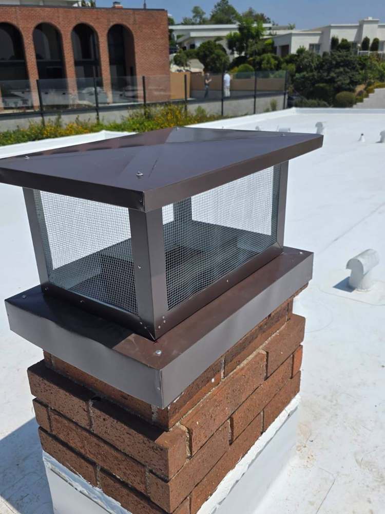 Chimney cap + downspouts + wall/window flashing in Venice