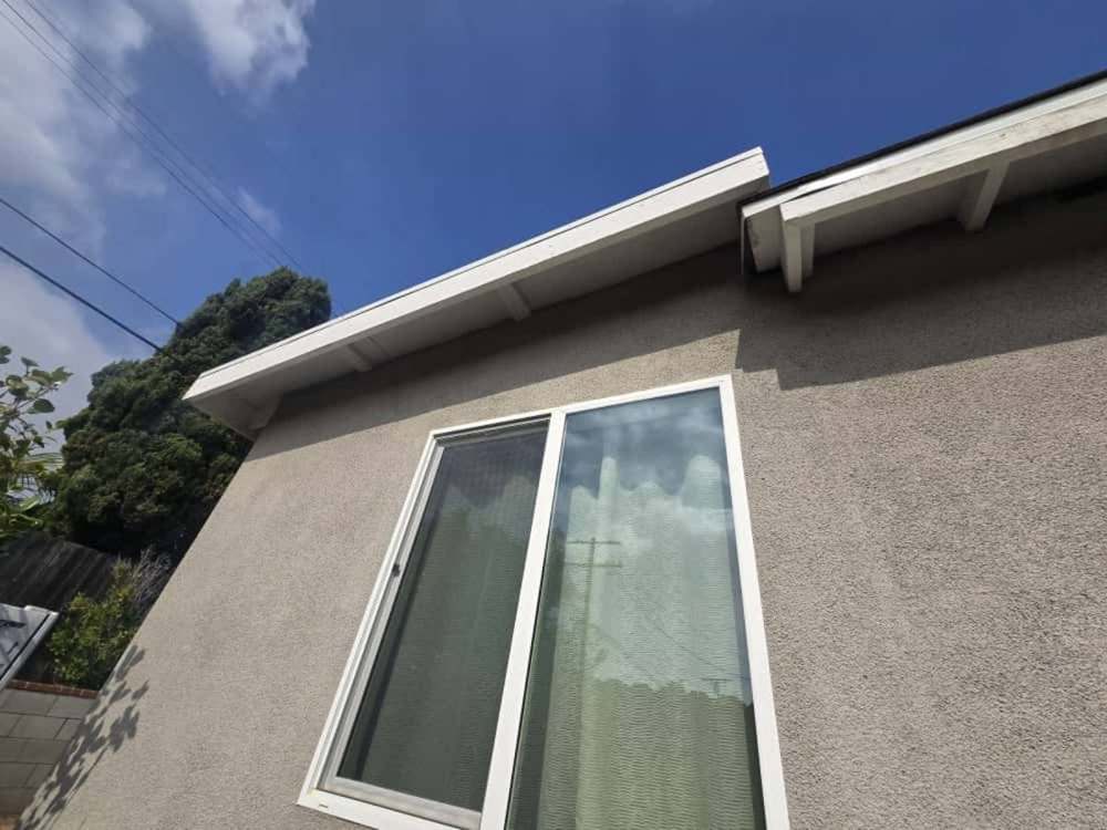 Flat-roof edge metal + skylight curb flashing in Pacific Palisades
